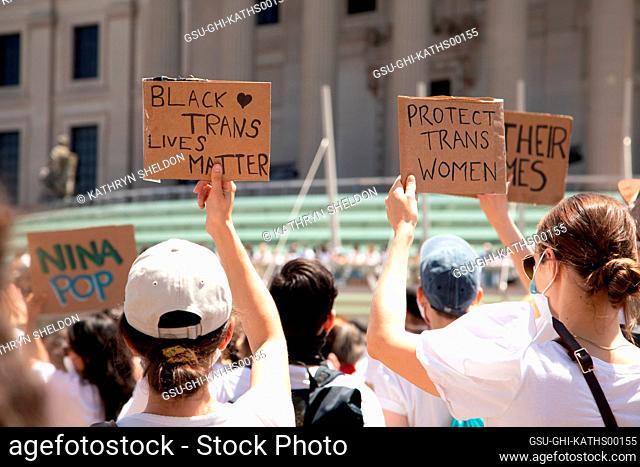 Protesters holding up Black Trans Lives Matter and Protect Trans Women Signs during Protest outside Brooklyn Museum, Brooklyn, New York, USA