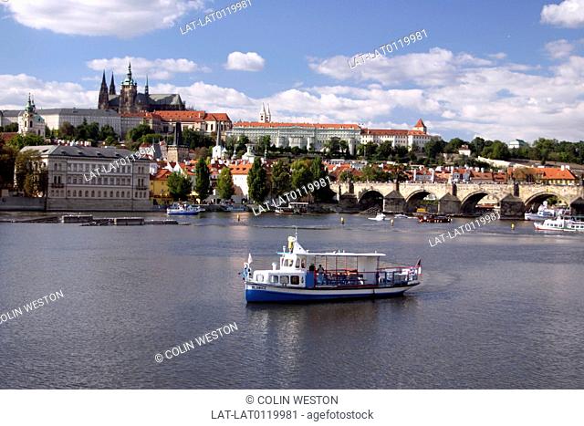 River Vlatava. City. UNESCO world heritage site. Prague Castle. Lesser town. Historic buildings. Boat. Ferry