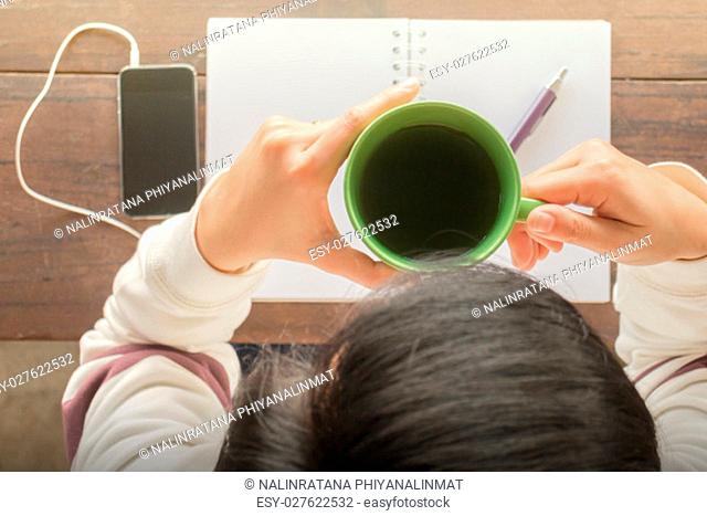 Working creative table and hot green tea drinking, stock photo