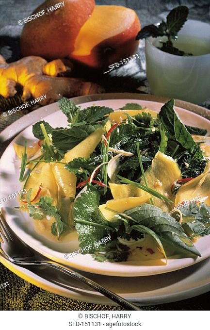 Mixed herb salad with mango and ginger
