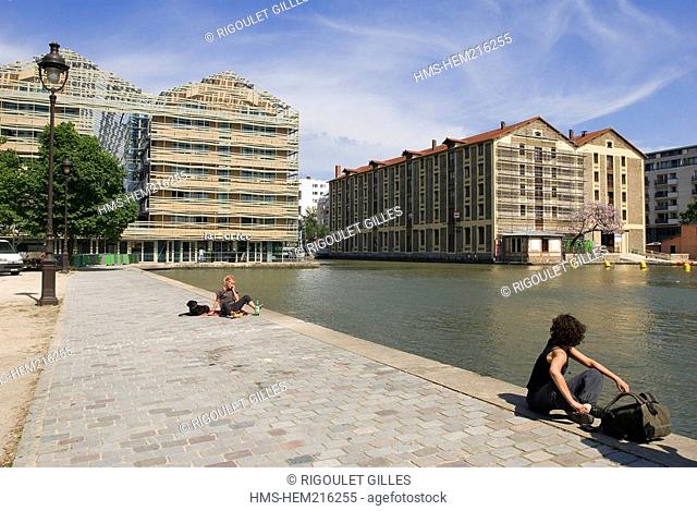 France, Paris, bassin de la Villette, former general stores converted into an youth hostel, restaurant and Holiday Inn Express Hotel labelled Haute Qualite...