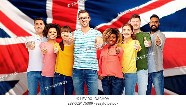 diversity, race, ethnicity, immigration and people concept - international group of happy smiling men and women showing thumbs up over english flag background