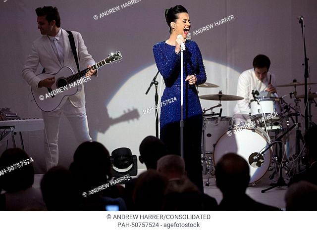Singer Katy Perry performs during a a concert commemorating the Special Olympics with United States President Barack Obama (first row