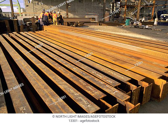 Large steel beams at industrial construction site