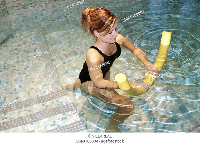 WOMAN IN REHABILITATION<BR>Photo essay.<BR>Therapy pool at Dinan, in the Britanny region of France.   The sensation of weightlessness is the large advantage to...