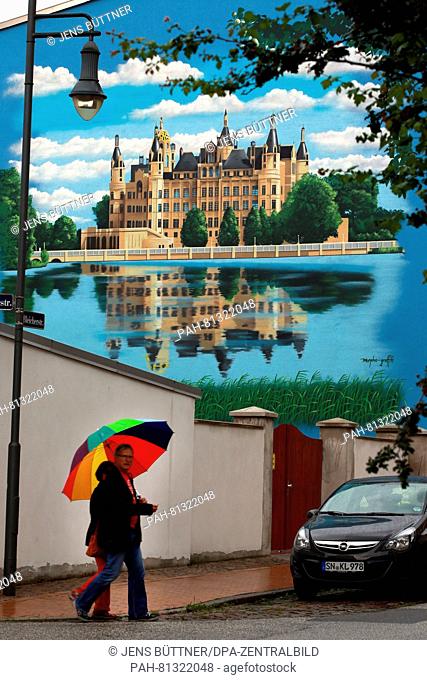 A wall painting by graffiti artist Daniel Wrede in Schwerin, Germany, 18 June 2016. More and more people order graffiti artists to design ehmpty walls and...