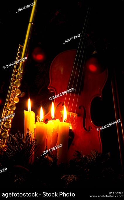 Burning candles, saxophone, violin