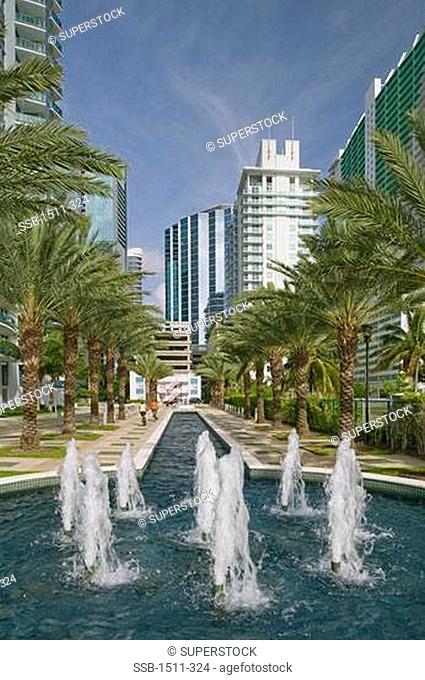 Fountains and trees in front of buildings, Brickell Ave, Biscayne Bay, Miami, Florida, USA
