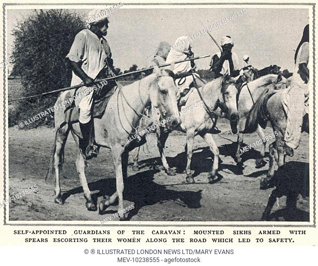 Armed Sikh men on horseback act as the self-appointed guardians fo the column of refugees travelling from East Punjab to Pakistan and safety following the...