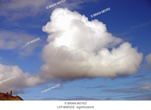 Scotland, Highland, Portree, Storr rock pinnacle and cloud on Isle of Skye