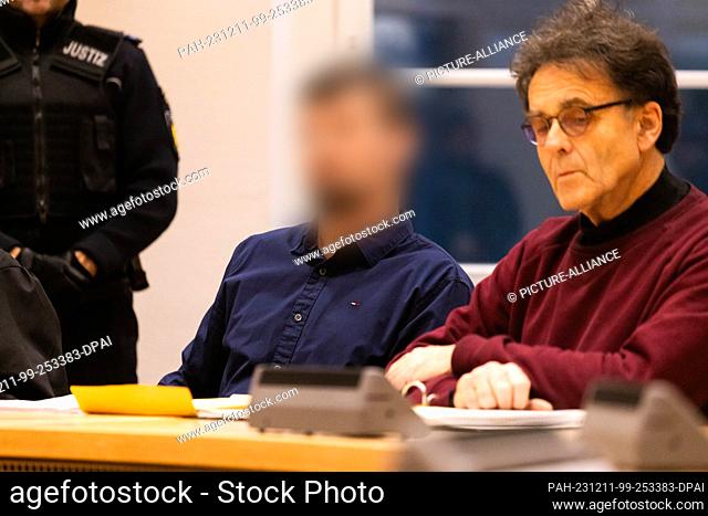 11 December 2023, Baden-Württemberg, Waldshut-Tiengen: A defendant (l) sits next to an interpreter (r). The accused (39), who comes from Latvia