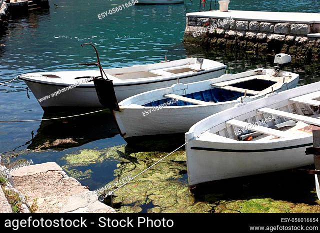 Old white wooden boat in Perast, Montenegro