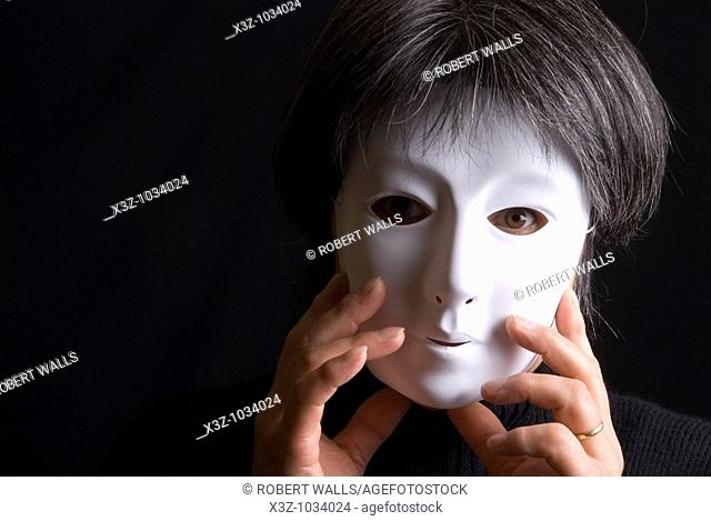 Woman wearing a plain white mask