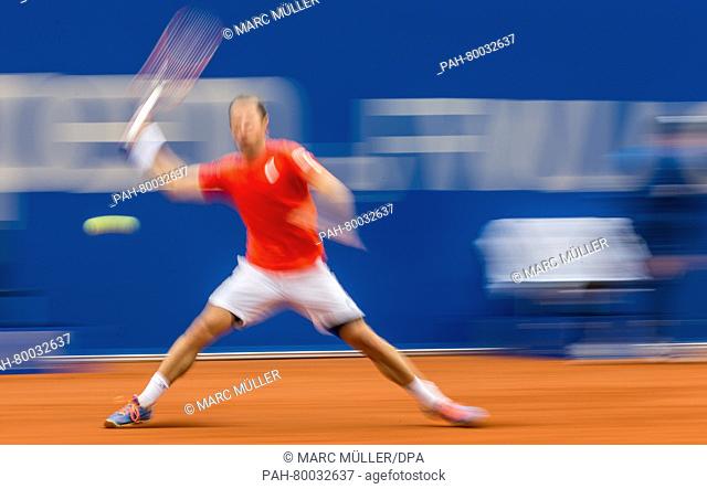 A long-exposure shot shows Germany's Philipp Kohlschreiber in action against Austria's Dominic Thiem (not pictured) during the final match of the ATP tennis...