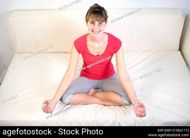 Woman sitting facing front during a meditation session
