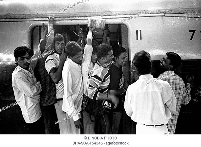 Crowded local train ; Bombay Mumbai ; Maharashtra ; India