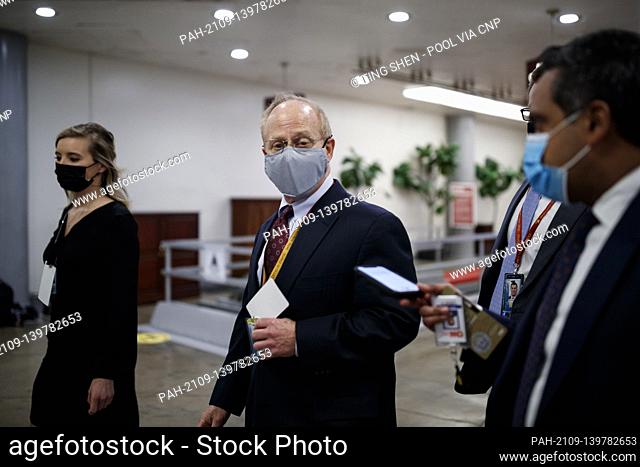 David Schoen, a member of president Trump’s defense team, wears a protective mask while walking through the Senate Subway at the U.S