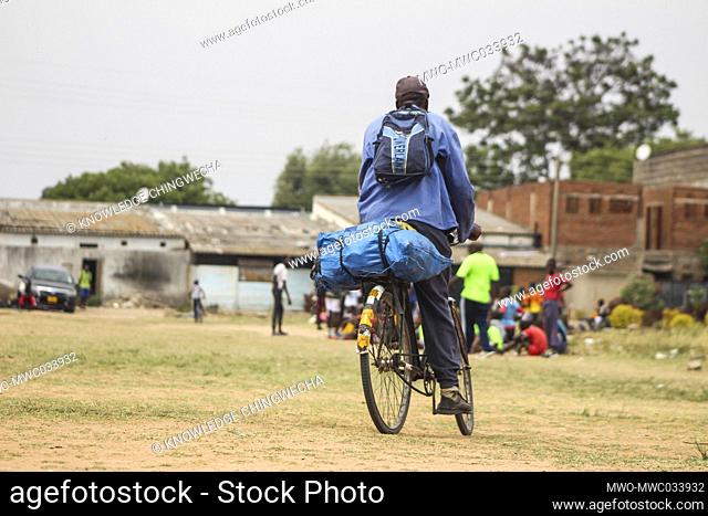 A man rides his bicycle in the small town of Chitungwiza Zimbabwe. Most Zimbabweans use bicycles as a mode of transport due to high transport charges for buses...