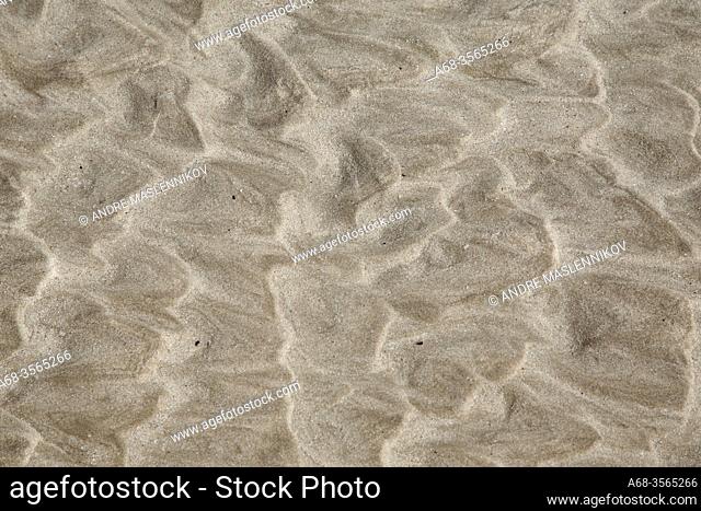 Pattern on the beach made of the waves. Oman. Photo: André Maslennikov
