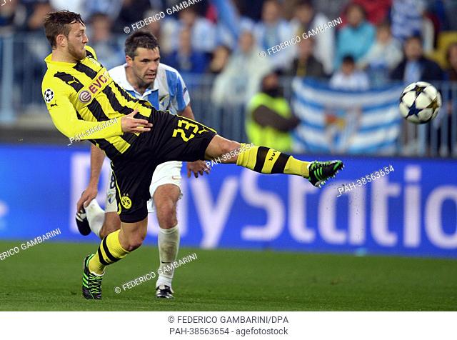 Dortmund's Julian Schieber (L) and Malaga's Jeremy Toulalan vie for the ball during the UEFA Champions League quarter final first leg soccer match between...