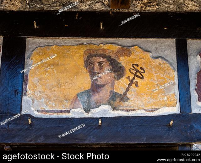 Painted head of a patron god, Taberna of the Four Deities, Via dellAbondanza, ancient city of Pompeii, Campania, Italy, Europe