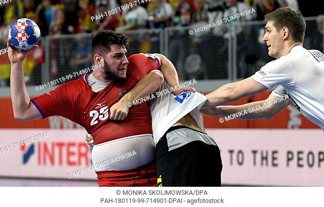 Germany's Patrick Wiencek (C, covered) and Finn Lemke in action against Czech Republic's Leos Petrovsky (L) during the European Handball Championship match...