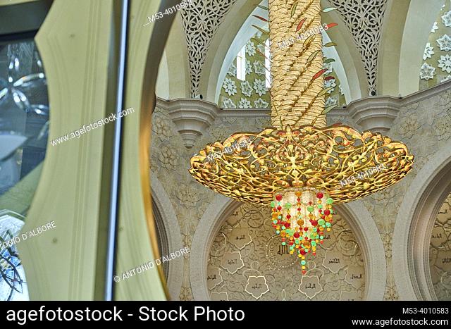 A large decorated chandelier hanging in the prayer room at Sheikh Zayed Mosque. Abu Dhabi. United Arab Emirates