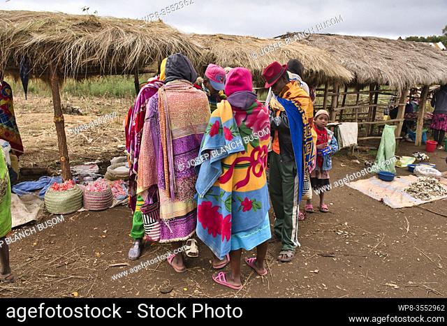 Men negotiating in a local market of the Betsileo ethnic group, on the road to Fianarantsoa