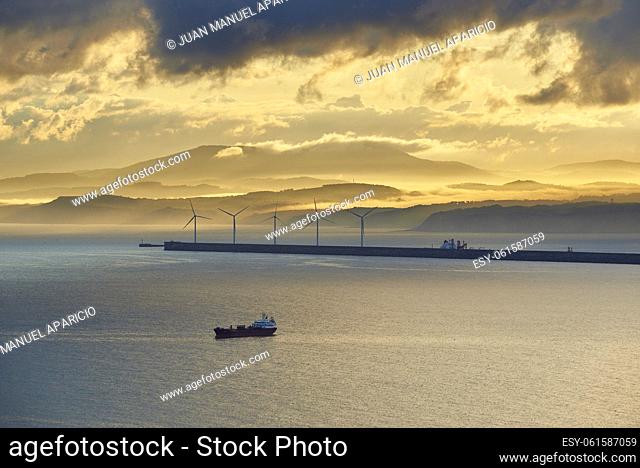 Wind Turbines and Cargo Vessel in the Port of Bilbao, Biscay, Basque Country, Euskadi, Euskal Herria, Spain, Europe
