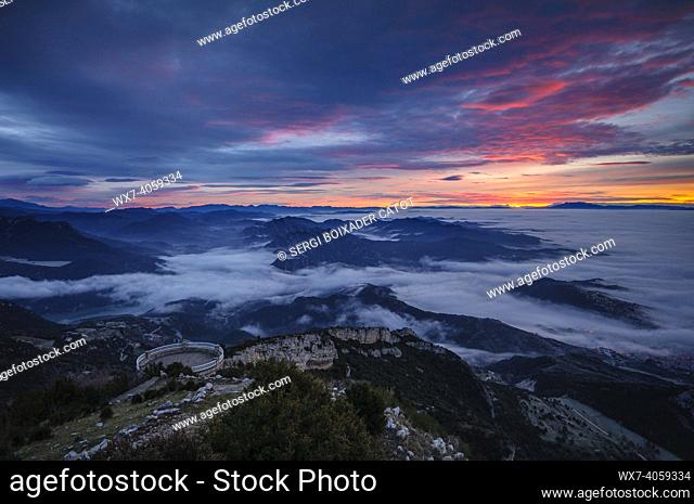 Winter sunrise seen from the Figuerassa viewpoint, with a sea of clouds in central Catalonia (BerguedÃ , Barcelona, Catalonia, Spain, Pyrenees)
