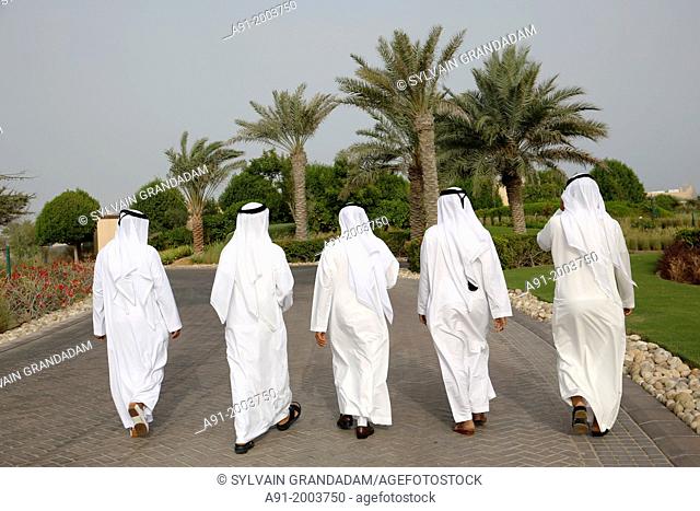 United Arab Emirates (UAE), Abu Dhabi, Sir Bani Yas island, five bearded men in white kandoura dishdash