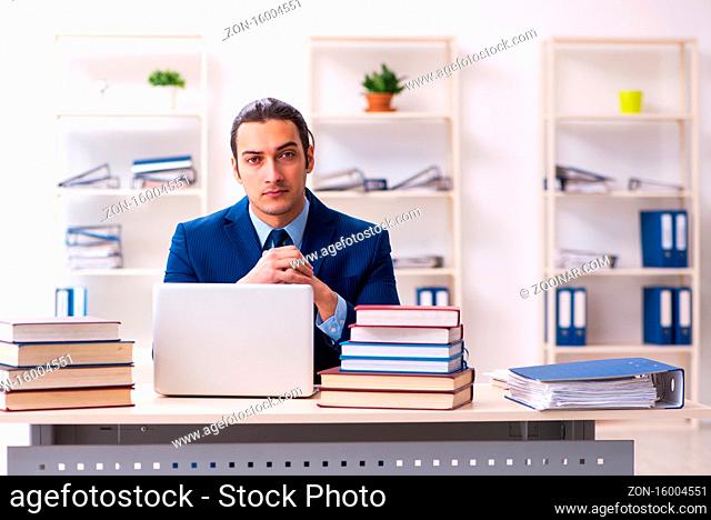 Young businessman student studying at the workplace