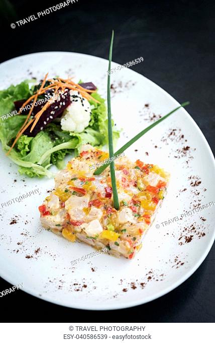 gourmet asian fusion cuisine marinated raw tuna tartare with spicy tropical mango lime sauce meal