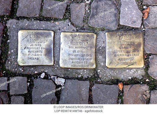 Three of many brass memorials set in the pavement in Hackescher in Berlin to commemorate Jewish Holocaust victims