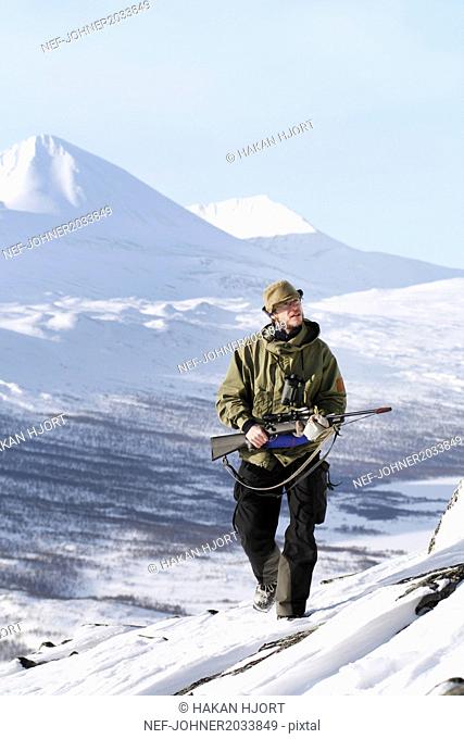 Hunter in mountains
