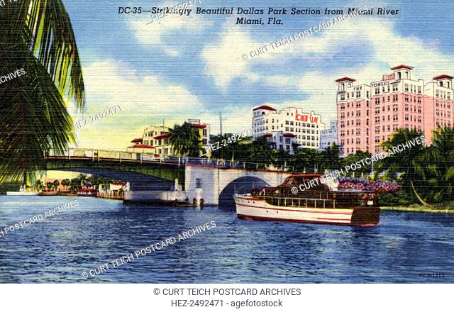 'Strikingly beautiful Dallas Park section from Miami River, Miami, Florida', USA, 1950. Vintage linen postcard showing a view of Dallas Park from the Miami...