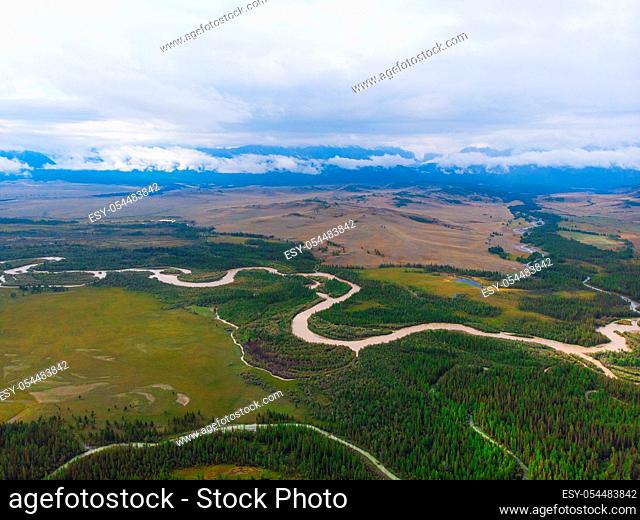 Aerial view of Kurai steppe and Chuya river on North-Chui ridge background. Altai mountains, Russia