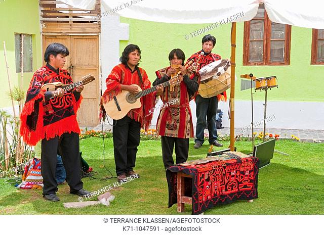 A group of four musicians entertaining at a restaurant in Sicuani, Peru, South America