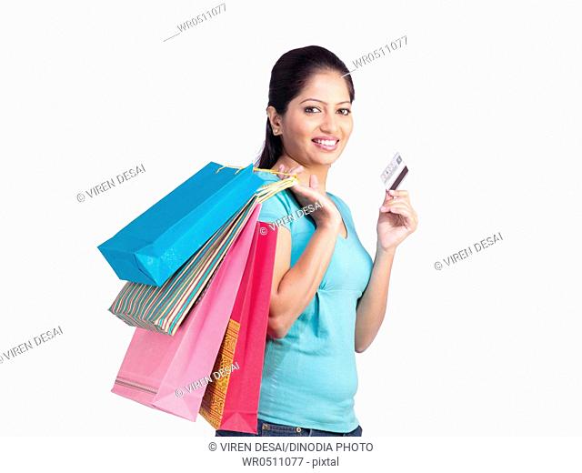 Sikh lady holding colourful shopping bags and credit card MR702Z