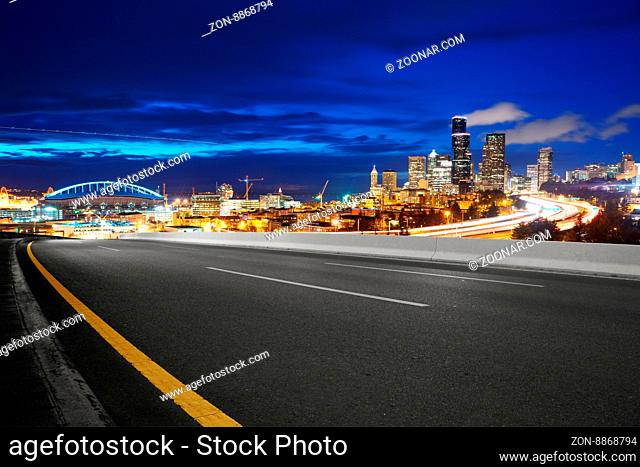 asphalt road with cityscape and skyline of seattle