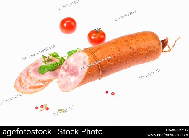 Isolated sausage with greenery on a white studio background