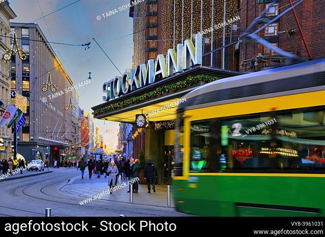 Stockmann Helsinki Centre, culturally significant department store in Helsinki, Finland, with shoppers and tram, defocused. December 3, 2019