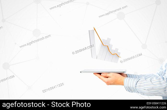 Businessman hand holding tablet with finance graph on screen