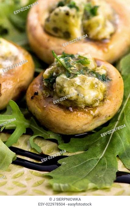 Delicious stuffed mushrooms with cheese and pesto