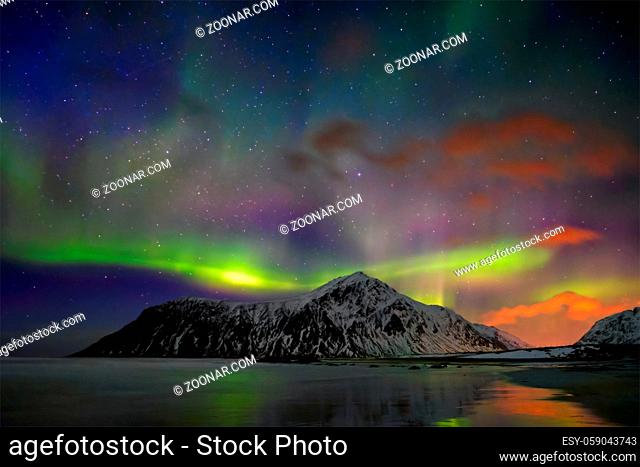 Aurora borealis northern lights on Skagsanden beach. Lofoten Islands, Norway