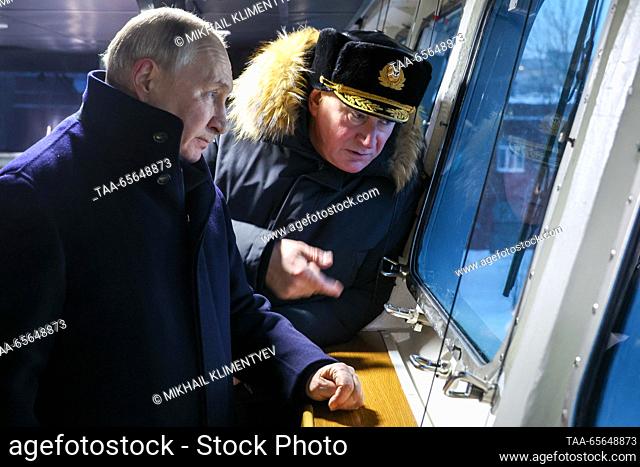RUSSIA, ARKHANGELSK REGION - DECEMBER 11, 2023: Russia's President Vladimir Putin (L) and Nikolai Yevmenov, commander-in-chief of the Russian Navy