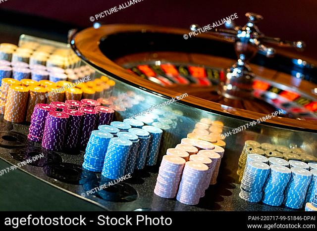 PRODUCTION - 30 June 2022, Baden-Wuerttemberg, Baden-Baden: A gaming table with chips for roulette stands in the Baden-Baden casino