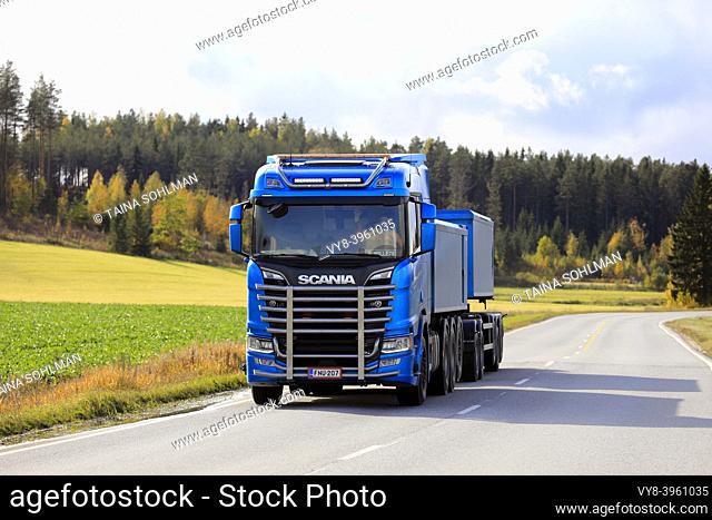 Blue Scania R650 truck with bull bar of Kuljetusliike Markus Hanninen for limestone haul on the road in autumn in Salo, Finland. October 4, 2019