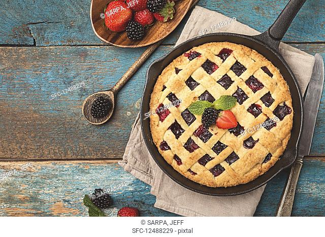 Homemade Traditional berry pie in a frying pan