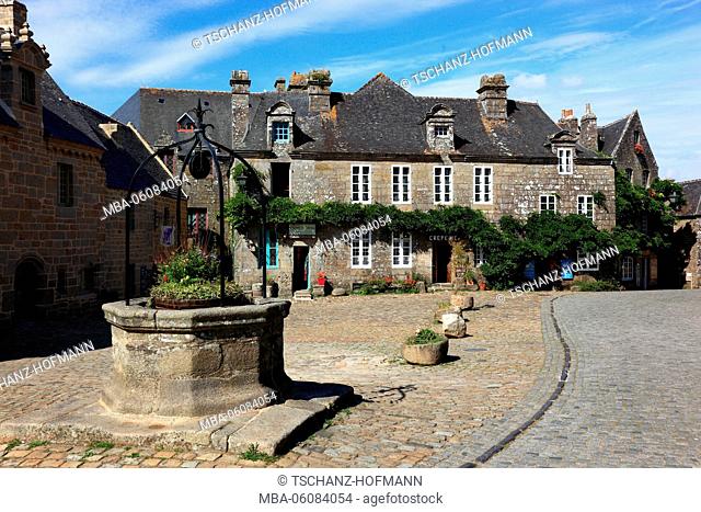 France, region of Brittany, houses in the medieval village Locronan, fountain on the marketplace